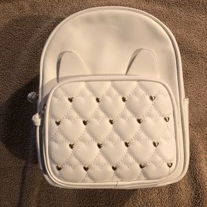 Under One Sky small backpack. New.